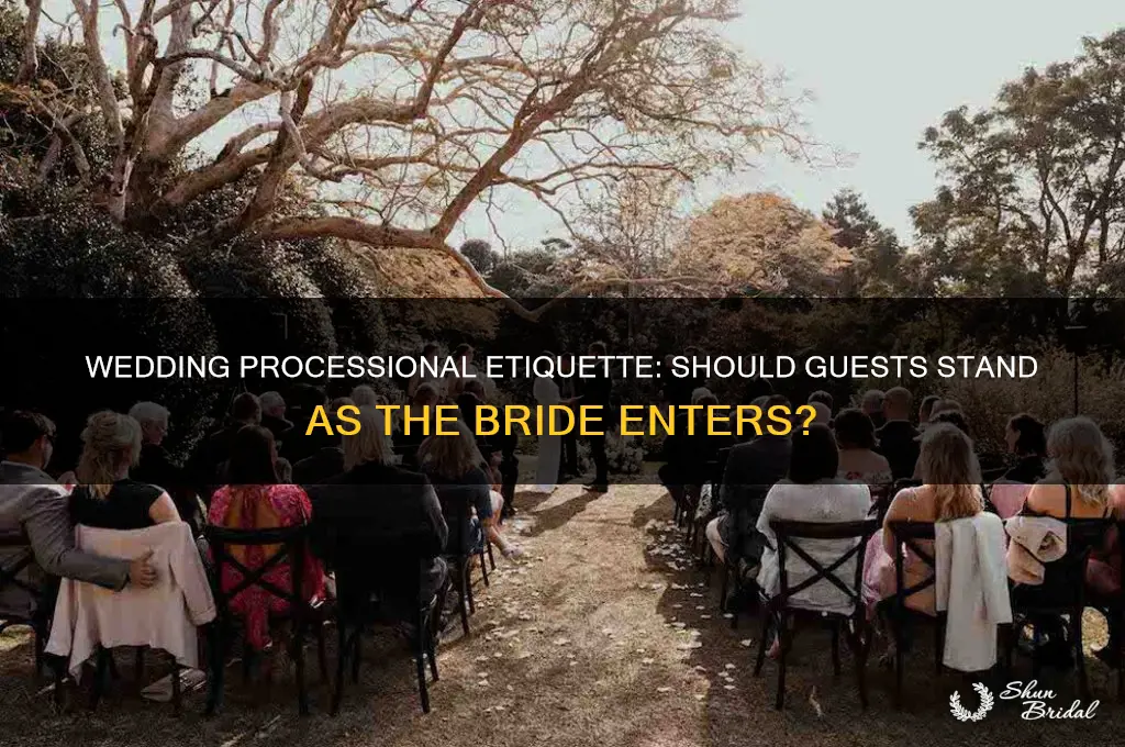 do guests stand during the wedding processional