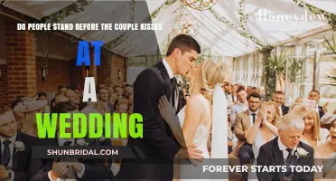 Wedding Kiss Etiquette: Should Guests Stand for the Couple's First Kiss?