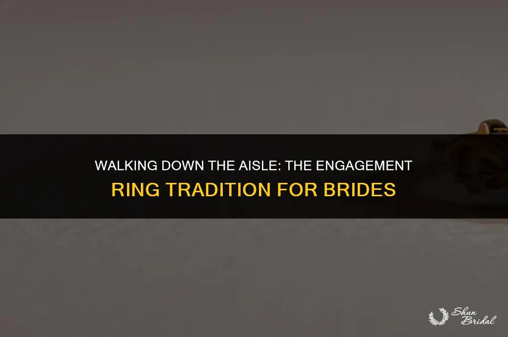 does bride wear engagement ring down aisle