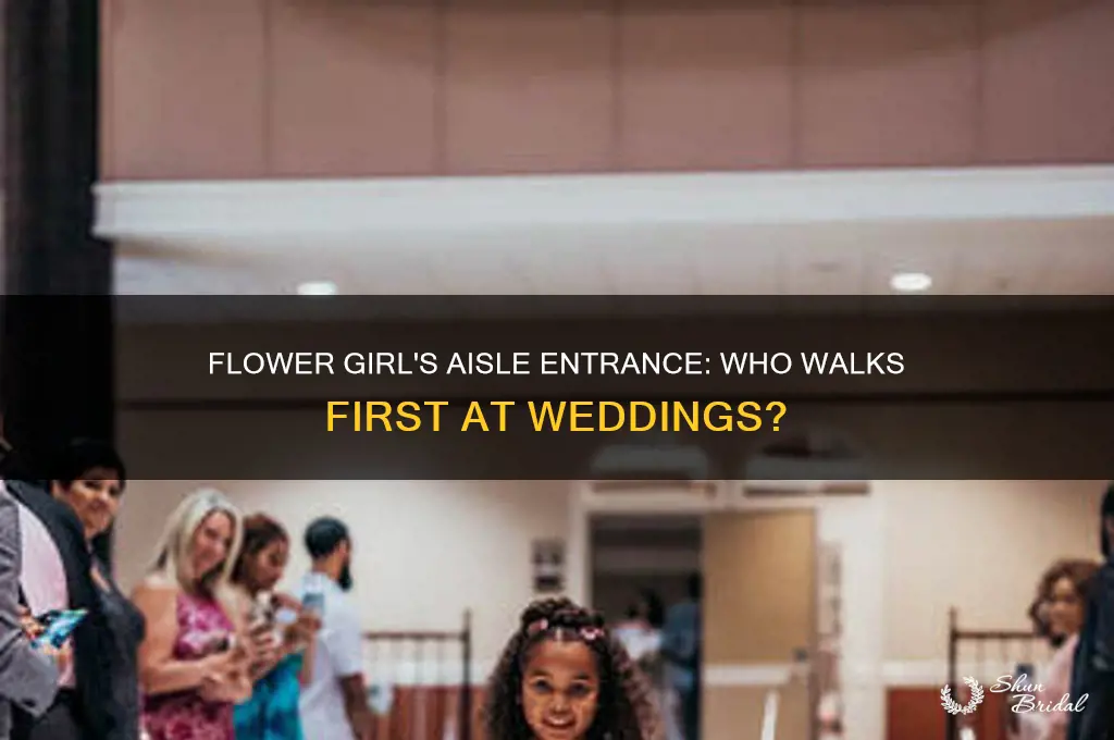 does the flower girl walk down the aisle first