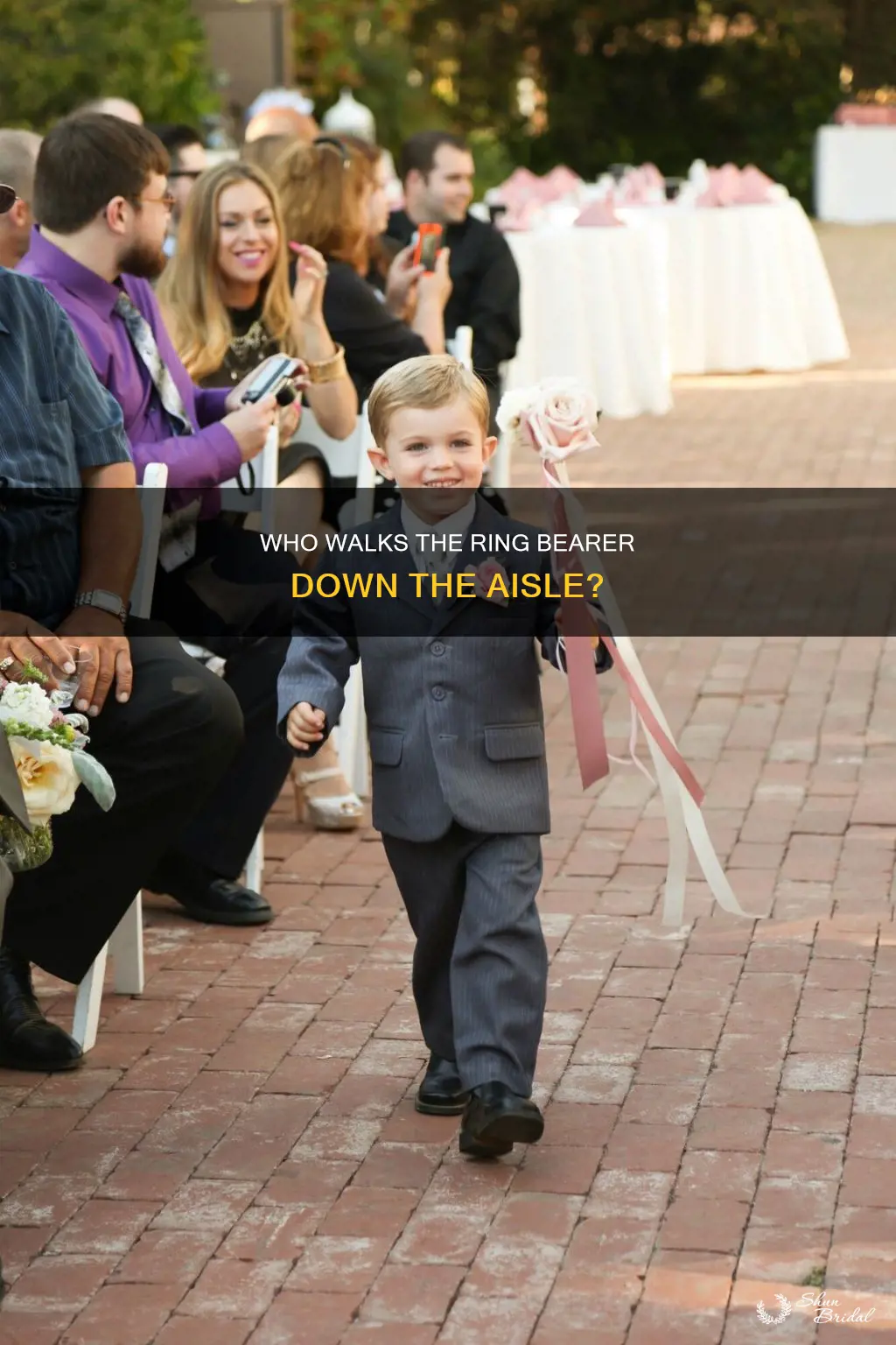 does the ring bearer walk down the aisle