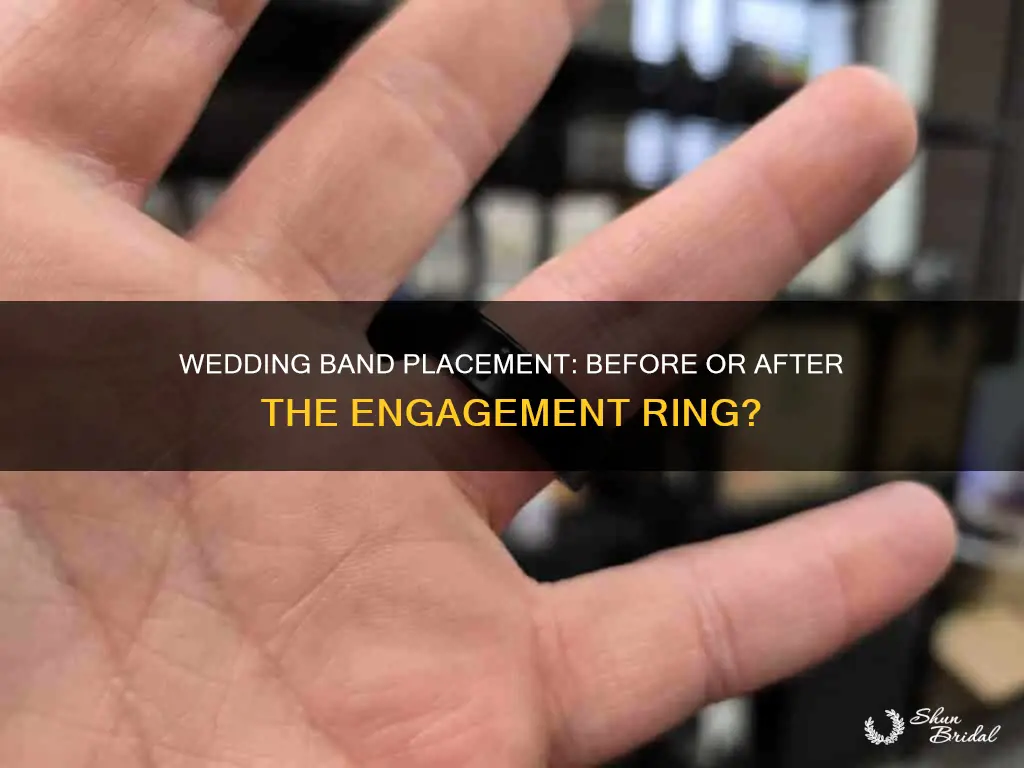 does the wedding band go in front of engagement ring