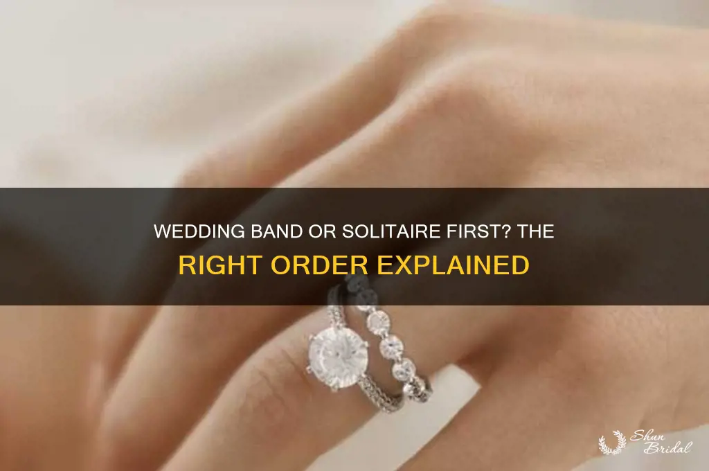 does the wedding band go on before the diamond solitaire