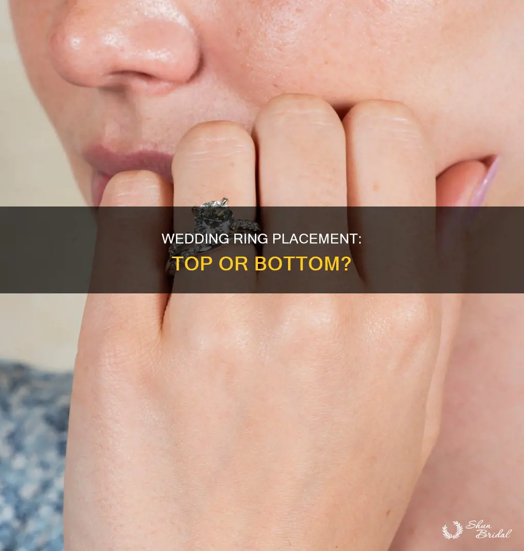 does wedding ring go on top or bottom