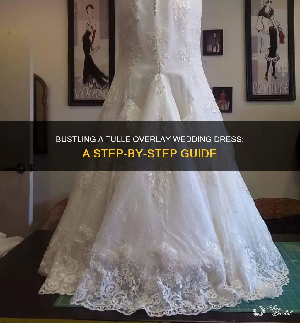 how to bustle a wedding dress with a tulle overlay