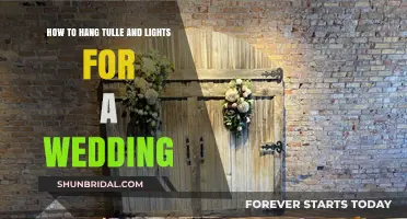 Elegant Wedding Decor: Hanging Tulle and Lights for a Magical Ambiance
