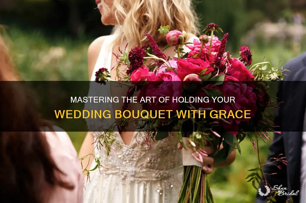 how to properly hold a wedding bouquet