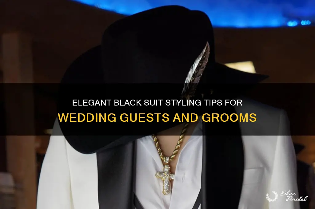 how to style a black suit for a wedding