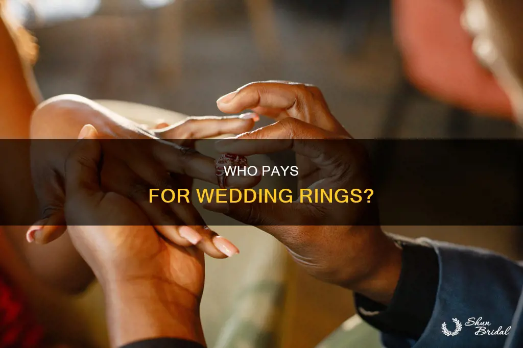 is the man supposed to buy both wedding rings
