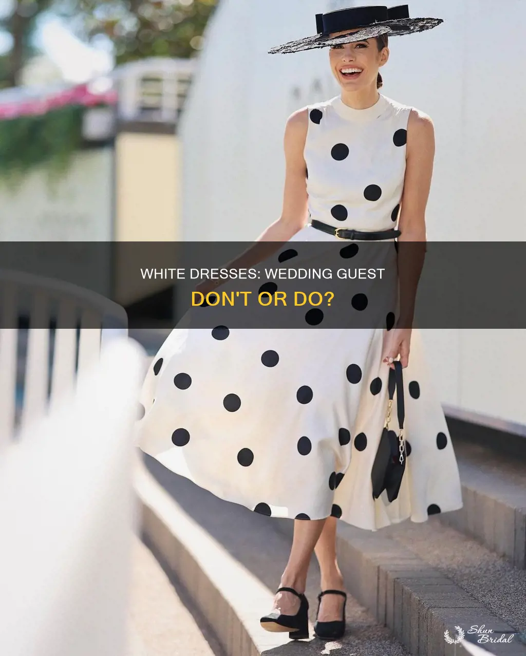 is wearing a white printed dress to a wedding