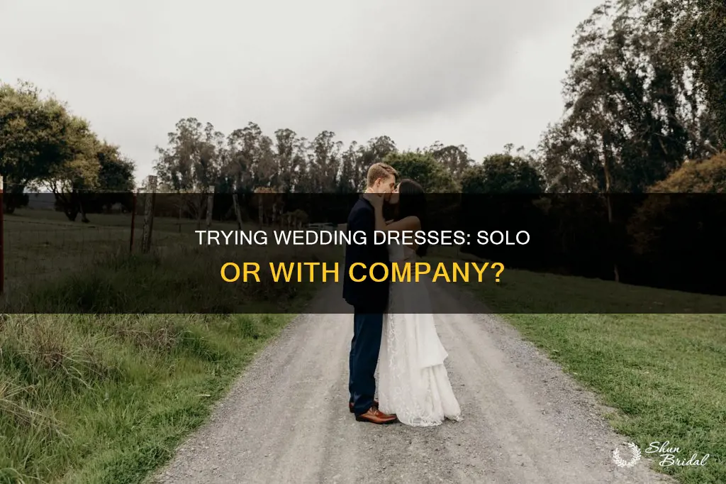 should I try on wedding dresses alone