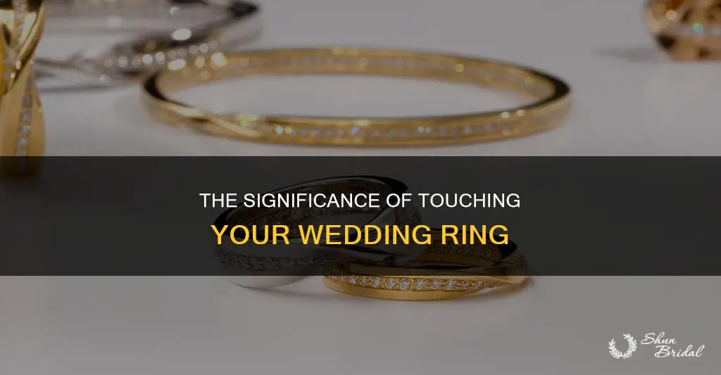 what does touching your wedding ring mean