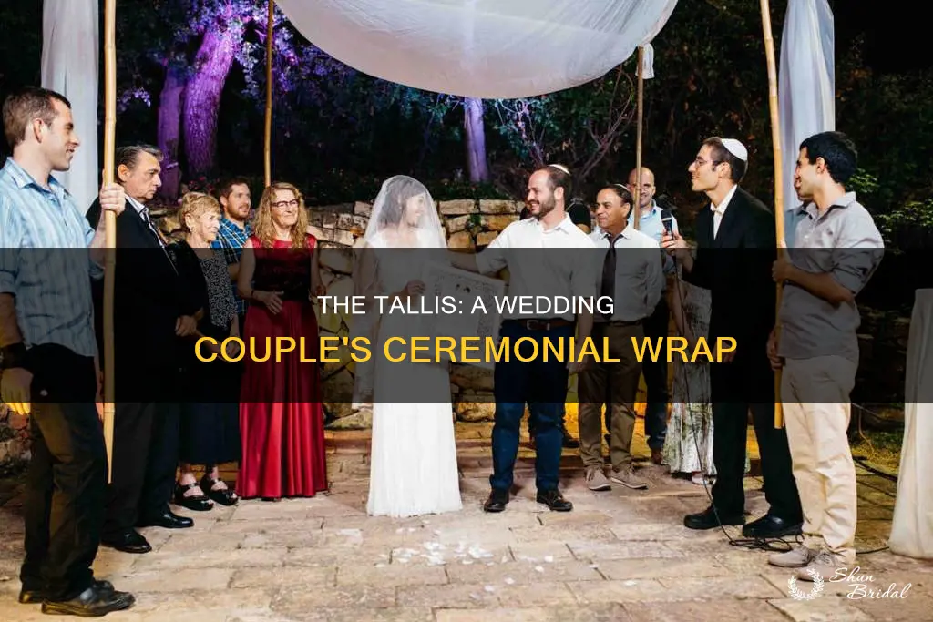 when do you put the tallis around the wedding couple