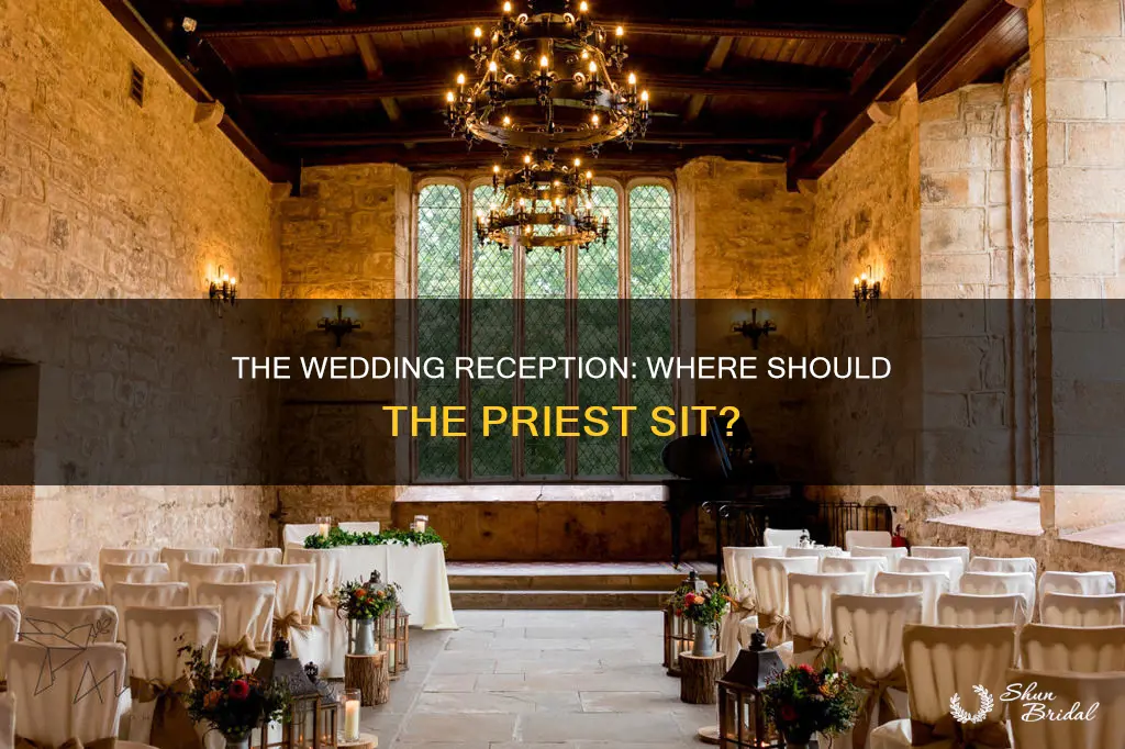 where does priest sit at wedding reception