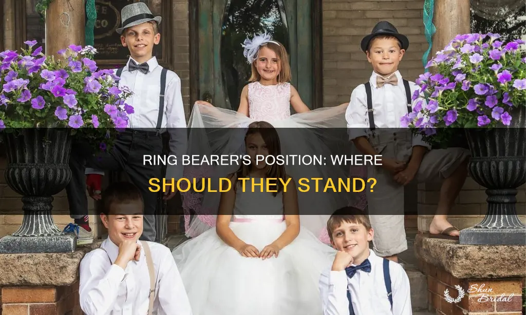 where does ring bearer stand in wedding